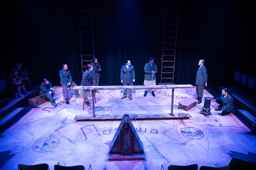 Theatre Production with eight actors on stage in russian uniforms